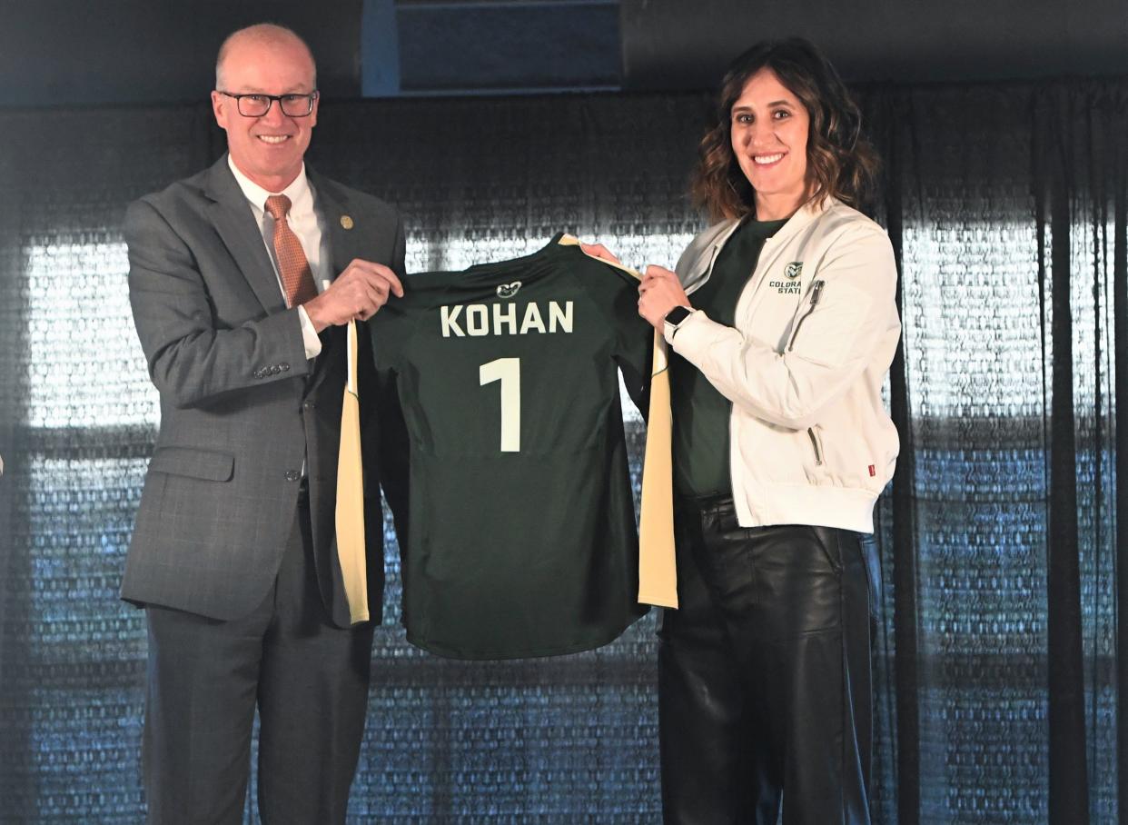 Colorado State athletic director Joe Parker and new CSU Volleyball head coach Emily Kohan hold up a Rams jersey during an introductory public announcement for her hiring on Friday, Dec. 16, 2022 at Canvas Stadium in Fort Collins, Colo.