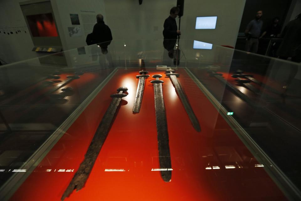 Viking swords are displayed part of a new exhibition entitled 'Vikings: Life and Legend' at the British Museum in central London, Tuesday, March 4, 2014. The new exhibition strives to make people think again about the Scandinavian pillagers who raided and struck terror into English villages. The exhibition aims to show how Viking energy and ideas re-drew the map of the world, through the presentation of their ships, their weapons, their crafts, their words and even their skeletons. (AP Photo/Lefteris Pitarakis)