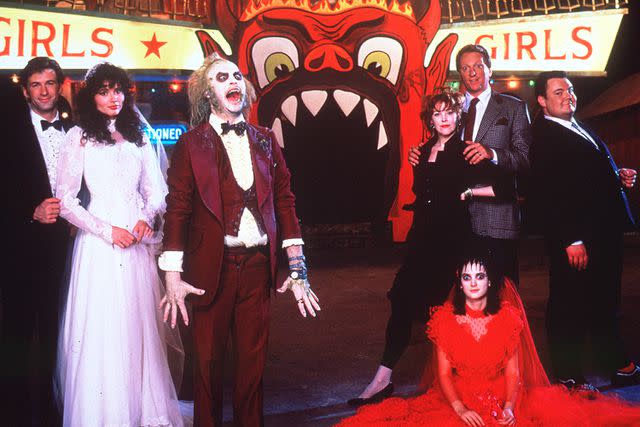 <p>PictureLux/The Hollywood Archive/Alamy</p> From L: Alec Baldwin, Geena Davis, Michael Keaton, Catherine O'Hara, Winona Ryder, Jeffrey Jones and Glenn Shadix in <em>Beetlejuice</em> (1988)