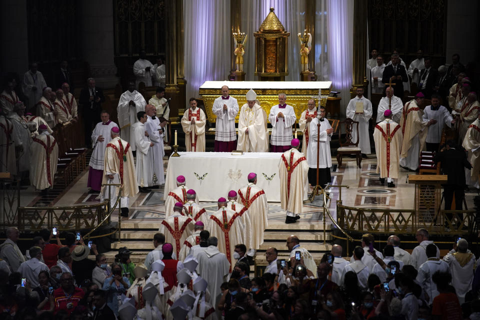 Pope Francis presides over a mass at the National Shrine of Saint Anne de Beaupre, Thursday, July 28, 2022, in Saint Anne de Beaupre, Quebec. Pope Francis is on a "penitential" six-day visit to Canada to beg forgiveness from survivors of the country's residential schools, where Catholic missionaries contributed to the "cultural genocide" of generations of Indigenous children by trying to stamp out their languages, cultures and traditions. (AP Photo/John Locher)