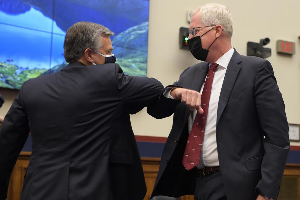 During the pandemic, professionals have taken to elbow bumping instead of shaking hands (Getty Images)