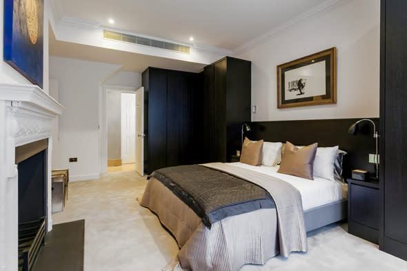 Pictured is a mock up of what a typical room would look like at the former Great Scotland building in Whitehall which is to be turned into a hotel.  The site of the first Met Police station where officers hunted Jack the Ripper is to be transformed into a five-star hotel with GBP10,000-A-NIGHT rooms.  See SWNS story SWPOLICE.  Great Scotland Yard in Whitehall was the headquarters of London?s newly formed police force from 1829 to 1890.   Officers investigated Jack the Ripper and the Plaistow murders from the base while Charles Dickens and Arthur Conan Doyle would regularly write about the top cop shop.  It later became a library for the Ministry of Defence but it was revealed yesterday (Sun) the Crown estate had struck a deal with a property developer to turn it into a super-posh hotel.   The Galliard Group has acquired a 125 year lease on the seven-storey building and plan to turn it into a GBP100 million hotel with 235 bedrooms and suites.  It will boast a grand entrance foyer, winter garden lounge, signature restaurant, cocktail bar and lounge, second lounge, library, 120 seater main conference room/ballroom, meeting rooms and function/private dining rooms.   There will also be special super-VIP suites for the richest of the rich - with the rooms costing a whopping GBP10,000 a night and putting them amongst the most expensive in the world.