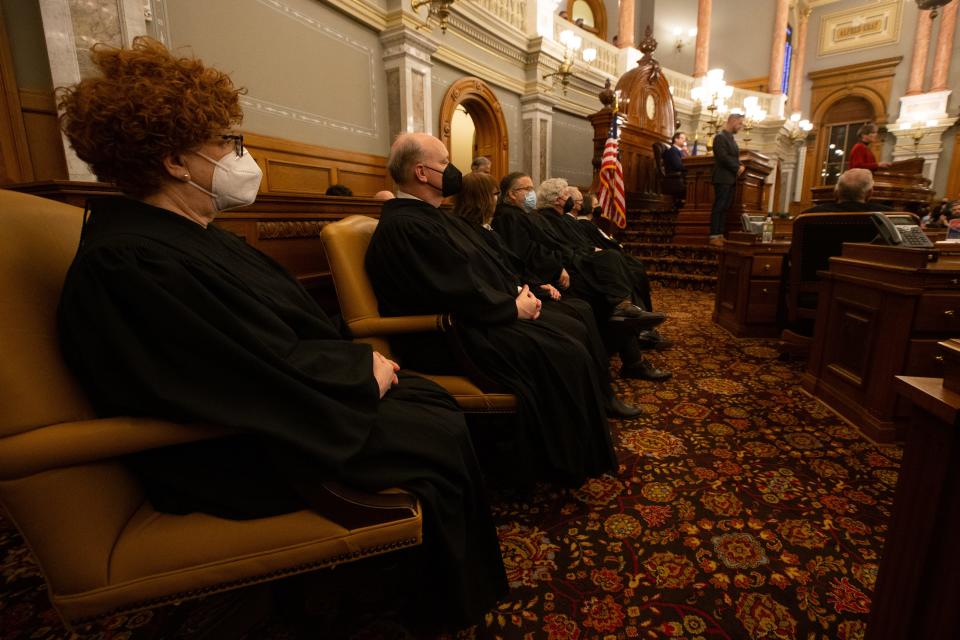 Justices of the Kansas Supreme Court watch Gov. Laura Kelly give her 2022 State of the State address. The high court heard arguments Monday on the constitutionality of a set of GOP-authored congressional maps.