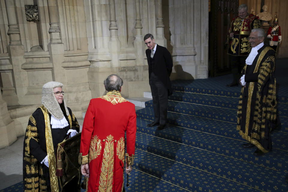 Britain's Leader of the House of Commons Jacob Rees-Mogg, center, ahead of the official State Opening of Parliament in London, Monday Oct. 14, 2019. (Hannah McKay/Pool via AP)