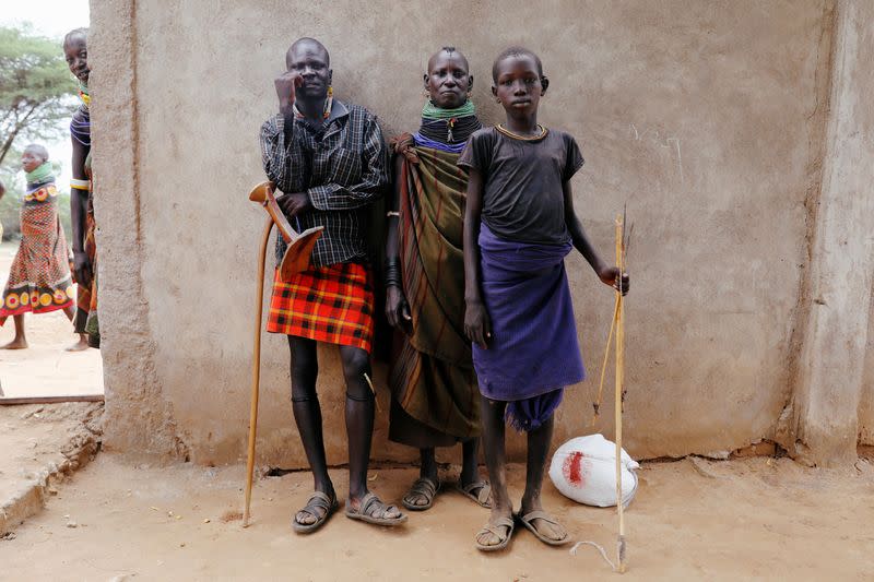 A family from the Turkana tribe pose for a picture in the village of Lorengippi near the town of Lodwar, Turkana county, Kenya