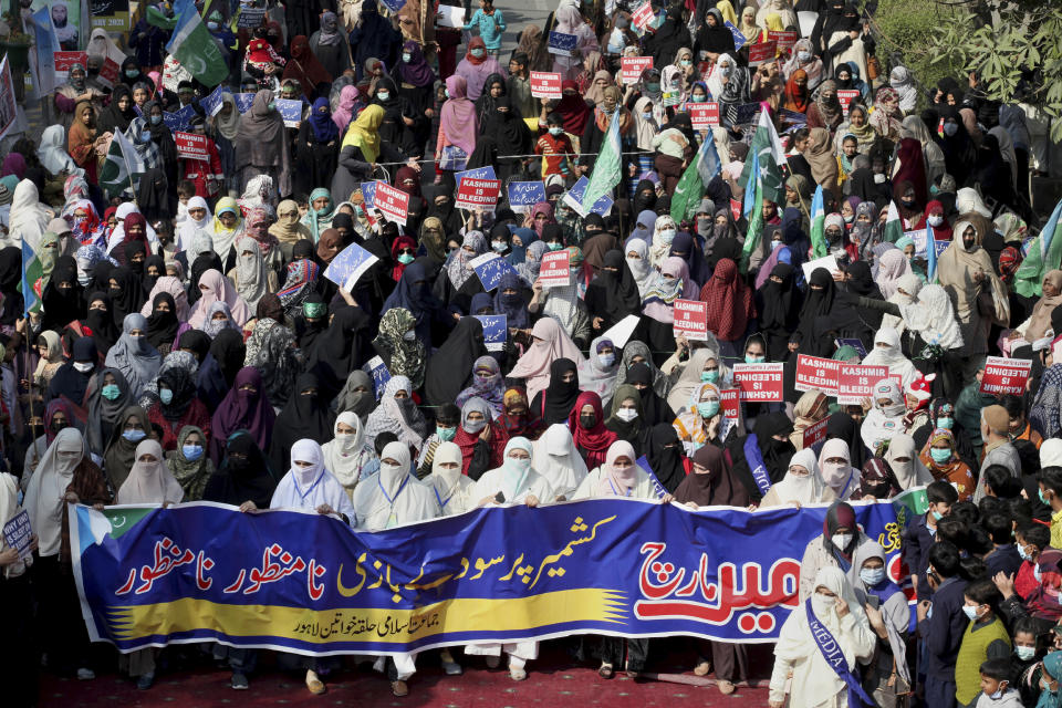 Supporters of the Pakistani religious group Jamaat-e-Islami participate in a rally to mark Kashmir Solidarity Day in Lahore, Pakistan, Friday, Feb. 5, 2021. Pakistan's political and military leadership on Friday marked the annual Day of Solidarity with Kashmir, vowing to continue political support for those living in the Indian-controlled part of Kashmir and for a solution to the disputed region's status in accordance with U.N. resolutions. (AP Photo/K.M. Chaudary)