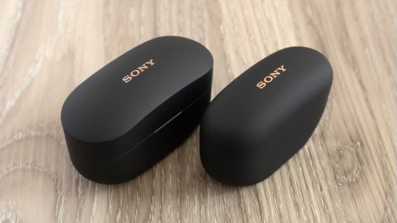 The Sony WF-1000XM5s’ charging case (right) is much smaller than the WF-1000XM4s’ charging case (left) and features a more rounded design that’s more comfortably carried in a pocket. - Photo: Andrew Liszewski | Gizmodo