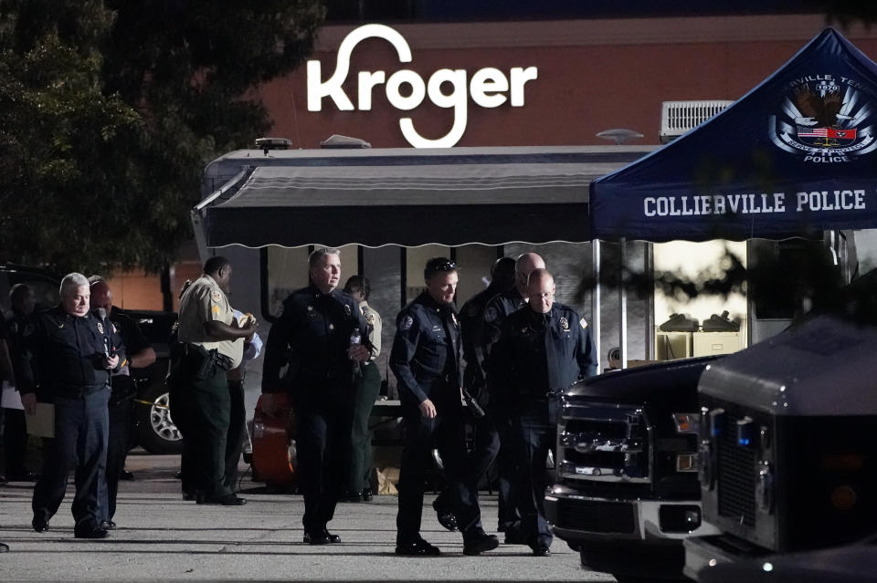 FILE - In this Thursday, Sept. 23, 2021, file photo, law enforcement personnel work in front of a Kroger grocery store as an investigation goes into the night following a shooting earlier in the day in Collierville, Tenn. The man who fatally shot one person and wounded 14 others before killing himself at a Tennessee grocery store last month used three guns purchased legally over the past year-and-a-half, investigators said Thursday, Oct. 7, 2021. (AP Photo/Mark Humphrey, File)