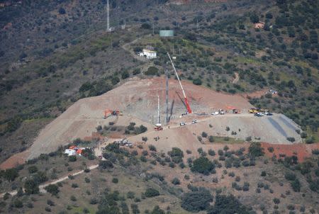 A crane removes steel tubes after failing to place them into the drilled well at the area where Julen, a Spanish two-year-old boy, fell into a deep well nine days ago when the family was taking a stroll through a private estate, in Totalan, southern Spain January 22, 2019. REUTERS/Jon Nazca