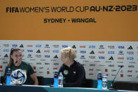 Ireland's head coach Vera Pauw, right, and captain Katie McCabe smile during a press conference at Stadium Australia in Sydney, Australia, Wednesday, July 19, 2023, ahead of their opening Women's World Cup soccer match against Australia, Thursday. (AP Photo/Rick Rycroft)