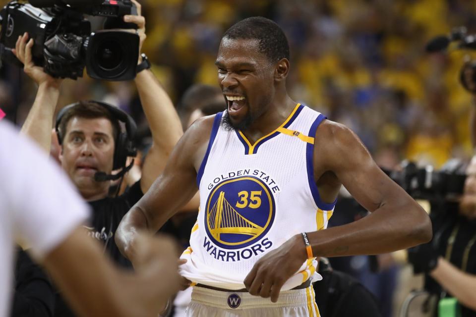 <p>Kevin Durant #35 of the Golden State Warriors celebrates after defeating the Cleveland Cavaliers 129-120 in Game 5 to win the 2017 NBA Finals at ORACLE Arena on June 12, 2017 in Oakland, California. </p>