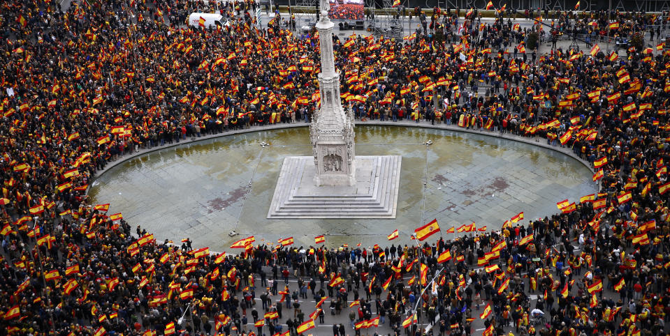 Thousands of demonstrators hold Spanish flags during a protest in Madrid, Spain, on Sunday, Feb.10, 2019. Thousands of Spaniards in Madrid are joining a rally called by right-wing political parties to demand that Socialist Prime Minister Pedro Sanchez step down. (AP Photo/Andrea Comas)