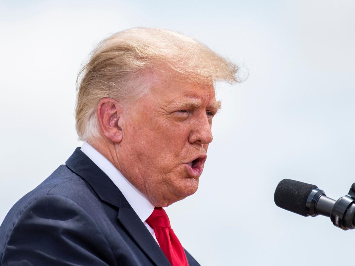 In this file photo taken on June 30, 2021 Former US President Donald Trump speaks during a visit to the border wall near Pharr, Texas (AFP via Getty Images)