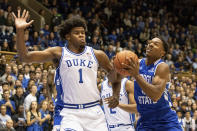 Georgia State's Kane Williams, right, drives against Duke's Vernon Carey Jr. (1) during the first half of an NCAA college basketball game in Durham, N.C., Friday, Nov. 15, 2019. (AP Photo/Ben McKeown)