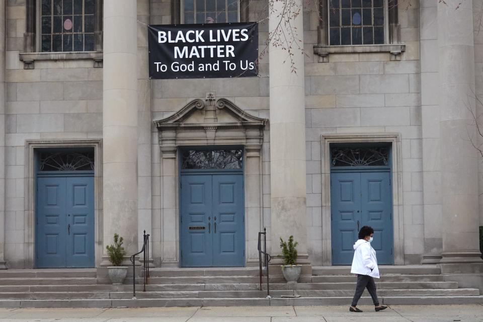 A Black Lives Matter sign hangs in front of the First Congregational Church of Evanston UCC on March 23, 2021 in Evanston, Illinois.