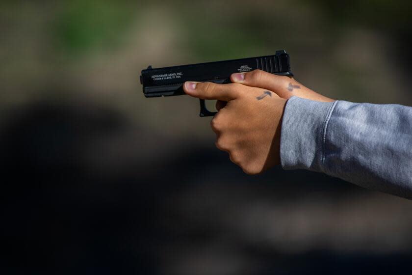 Azusa, CA - October 29, 2023: Daniel Villalpando, 16, shoots a target during a firearms education course by L.A. Progressive Shooters at Burro Canyon Shooting Park in Azusa, CA October 29, 2023. (Francine Orr/ Los Angeles Times)