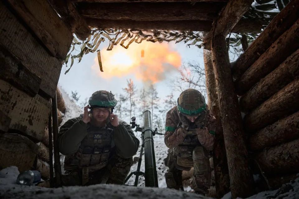 Mortar platoon soldiers with an 82mm mortar perform a combat mission as Ukrainian soldiers hold their positions in the snow-covered Serebryan Forest in temperatures of -15°C, on January 10, 2024 in Kreminna, Ukraine.