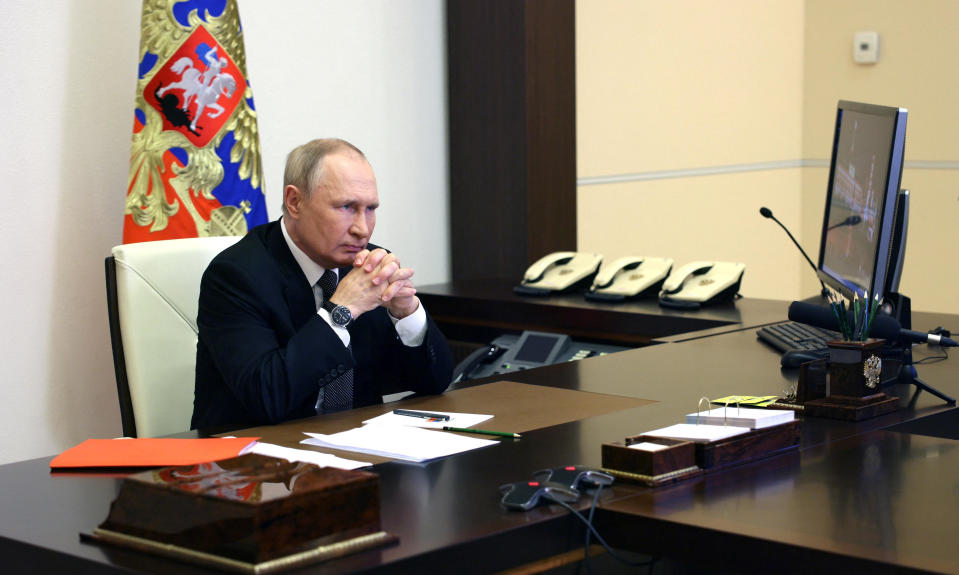 Russian President Vladimir Putin chairs a meeting with members of the Security Council via a video link at a residence outside Moscow, Russia, October 19, 2022.  / Credit: SPUTNIK via Reuters