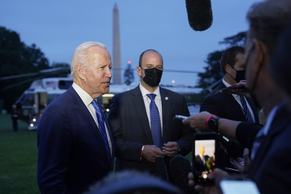 President Joe Biden talks with reporters after returning to the White House in Washington, Tuesday, Oct. 5, 2021, after a trip to Michigan to promote his infrastructure plan. (AP Photo/Susan Walsh)