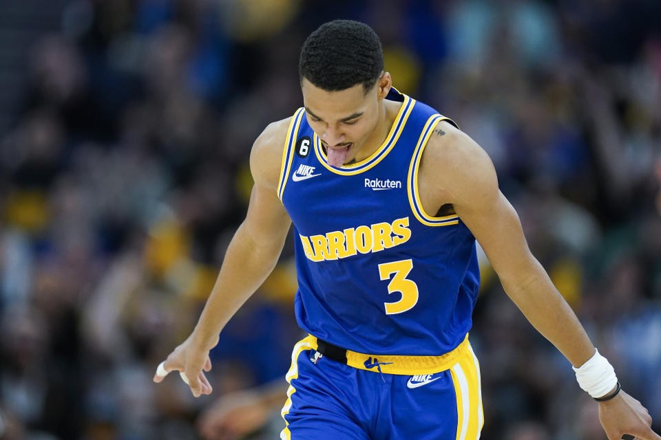 Golden State Warriors guard Jordan Poole reacts after scoring against the San Antonio Spurs during the first half of an NBA basketball game in San Francisco, Monday, Nov. 14, 2022. (AP Photo/Godofredo A. Vásquez)