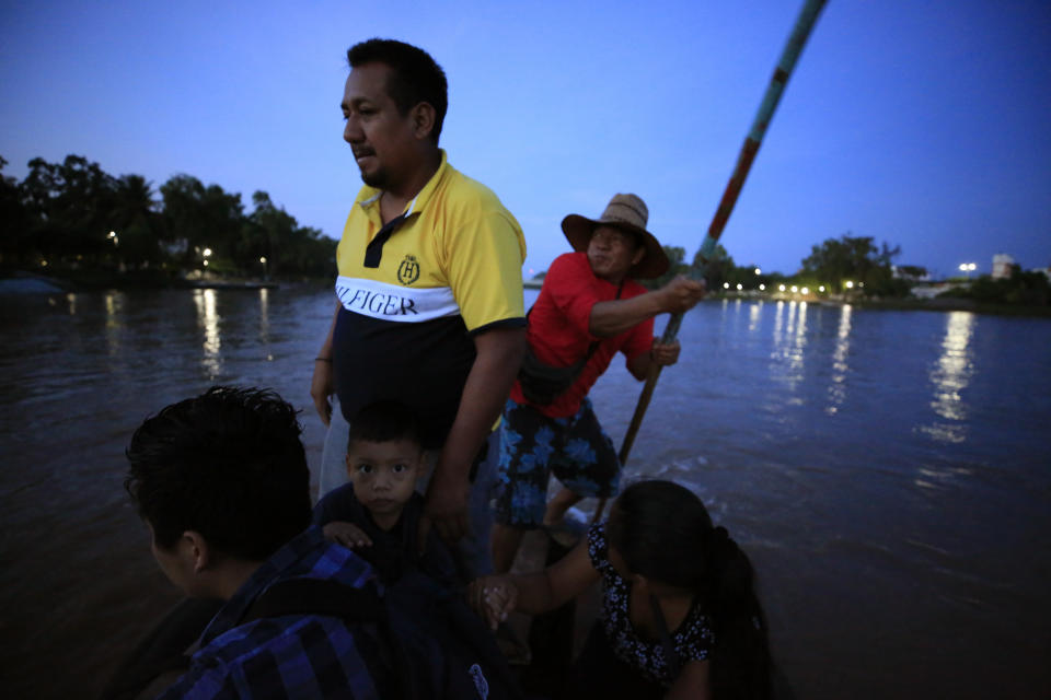 Passengers are ferried across the Suchiate River to Guatemala, from Ciudad Hidalgo, Mexico, at sunrise on Saturday, June 15, 2019. A free flow of goods and people crossing by raft has fueled the economy on both sides of the river as long as residents can remember, and many worry that the arrival of the National Guard could hurt business. (AP Photo/Rebecca Blackwell)