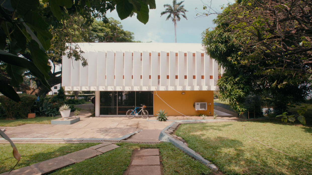  A white and orange house in the European modernist style. 