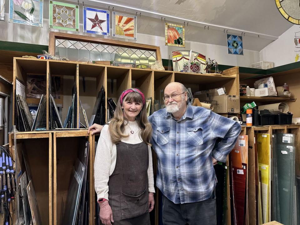 Jeanne and David Gomm smile in their home studio in Provo on April 18.