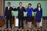 FILE - In this Sept. 18, 2021, file photo, candidates for the presidential election of the ruling Liberal Democratic Party pose prior to a debate session hosted by the Japan National Press Club in Tokyo. The stakes are high as Japanese governing party members vote Wednesday, Sept. 29, 2021 for the four candidates seeking to replace Yoshihide Suga as prime minister. The next leader must address a pandemic-battered economy, a newly empowered military operating in a dangerous neighborhood, crucial ties with an inward-focused ally, Washington, and tense security standoffs with an emboldened China and its ally North Korea. (AP Photo/Eugene Hoshiko, Pool, File)