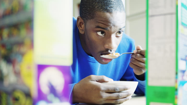 Young boy eating breakfast cereal