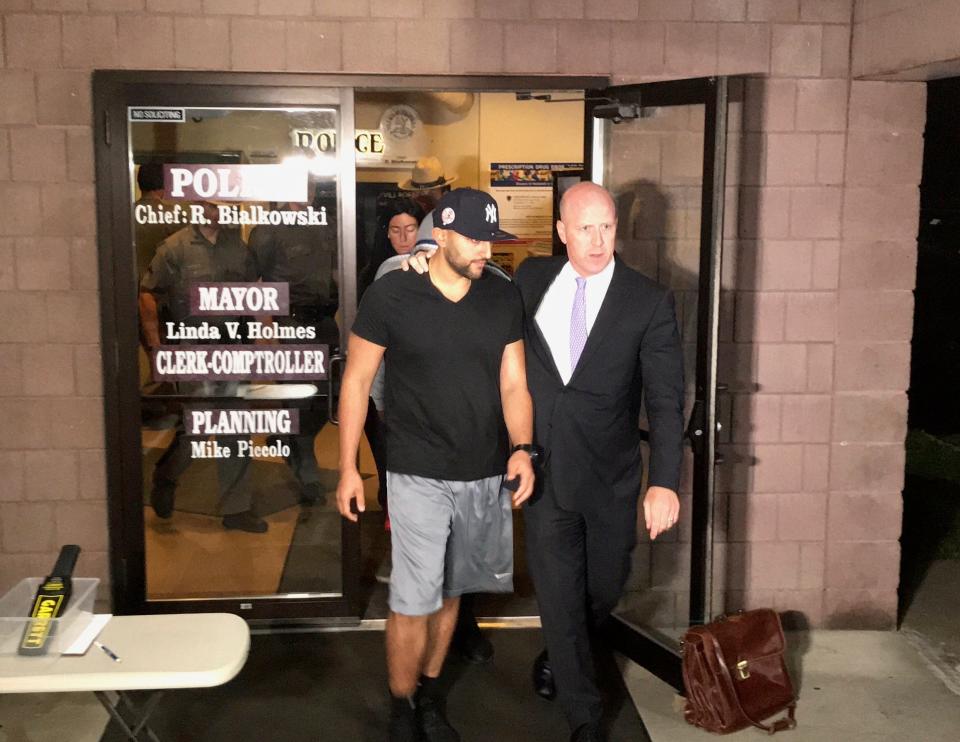 Nauman Hussain, left, leaves Cobleskill Town Court on Oct. 10, 2018, with attorney Lee Kindlon after he was arraigned and charged in connection with the deadly limo crash in Schoharie, N.Y., on Oct. 6, 2018.