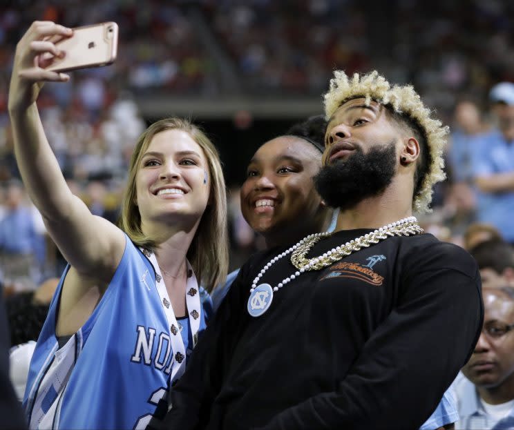 Odell Beckham poses with a fan at the Final Four last month. (AP)