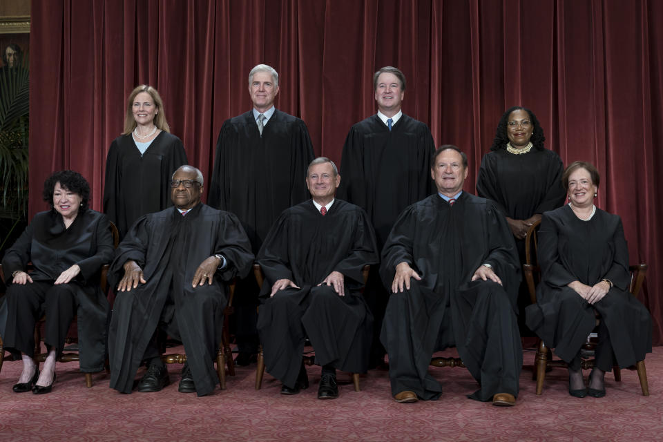 FILE - Members of the Supreme Court sit for a group portrait in Washington, Oct. 7, 2022. Bottom row, from left, Justice Sonia Sotomayor, Justice Clarence Thomas, Chief Justice John Roberts, Justice Samuel Alito and Justice Elena Kagan. Top row, from left, Justice Amy Coney Barrett, Justice Neil Gorsuch, Justice Brett Kavanaugh, and Justice Ketanji Brown Jackson. The Supreme Court justices will take the bench Monday, July 1, 2024, to release their last few opinions of the term, including their most closely watched case: whether former President Donald Trump has immunity from criminal prosecution. (AP Photo/J. Scott Applewhite)