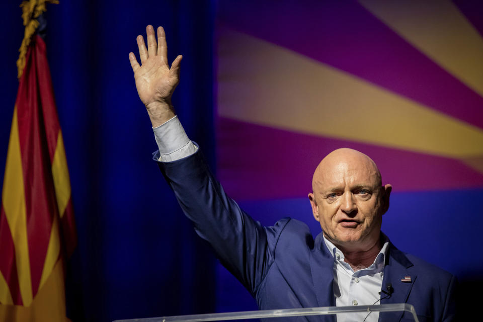 Sen. Mark Kelly, D-Ariz., waves supporters goodnight during an election night event in Tucson, Ariz., Tuesday, Nov. 8, 2022. (AP Photo/Alberto Mariani)