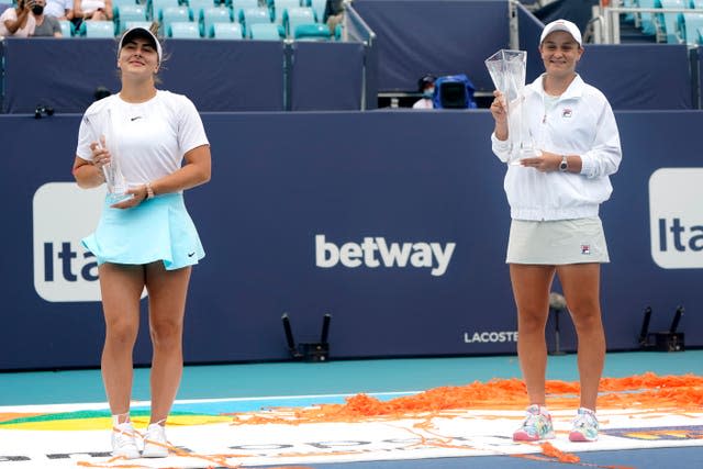 Australia's Ashleigh Barty, right, retained her Miami Open tennis title after Canada's Bianca Andreescu was forced to retire due to injury