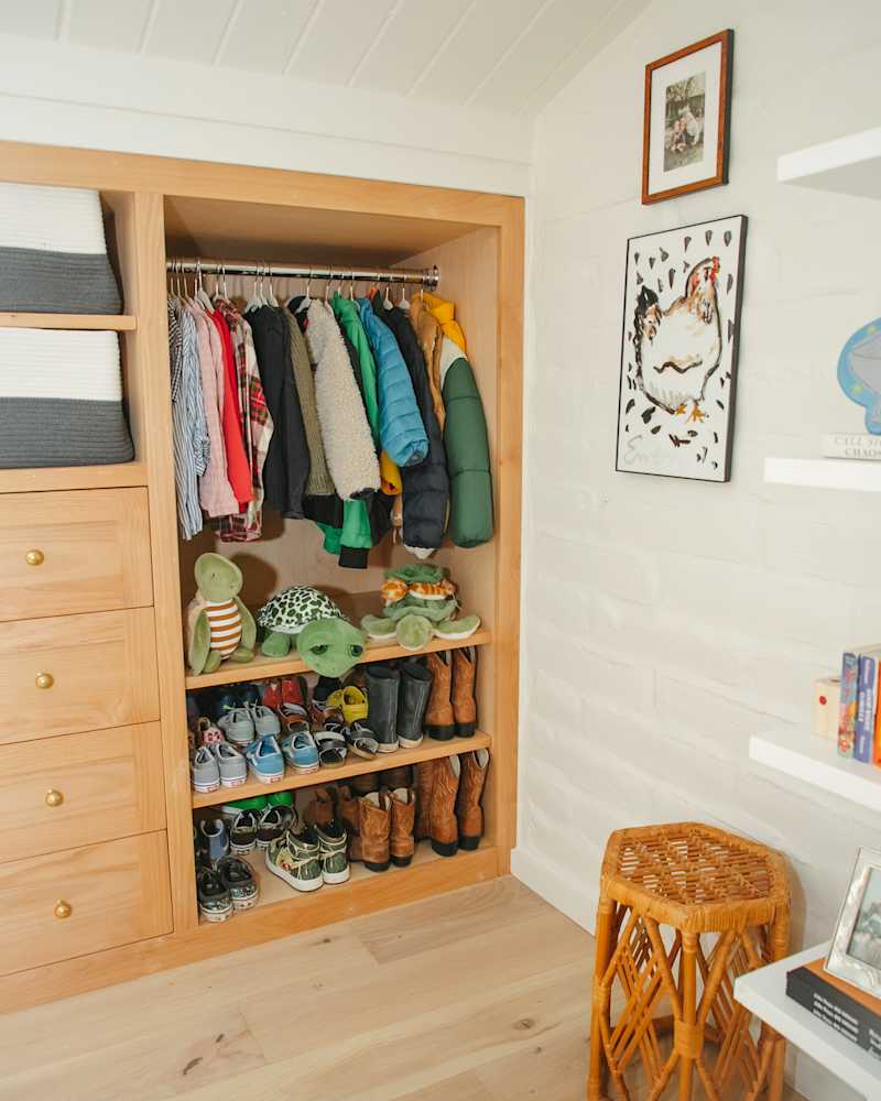 Built in wood closet with kids clothes and shoes