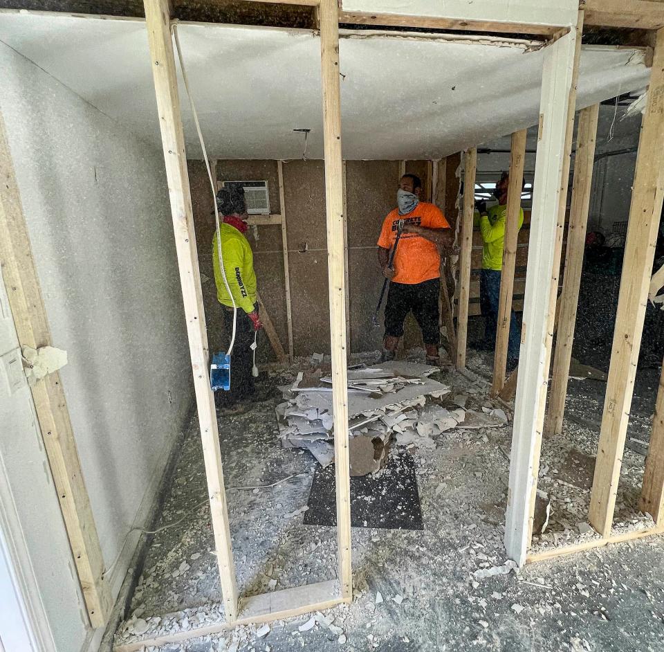 A small room is demolished inside the Ferriter family' garage in Jupiter's Egret Landing neighborhood on March 5, 2022. Timothy and Tracy Ferriter were arrested Feb. 8 and charged which child abuse and false imprisonment after investigators learned they locked their 14-year-old teen in the room for up to 18 hours at a time when they were misbehaving.