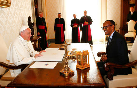 Pope Francis talks with Rwanda's President Paul Kagame during a private meeting at the Vatican March 20, 2017. REUTERS/Tony Gentile