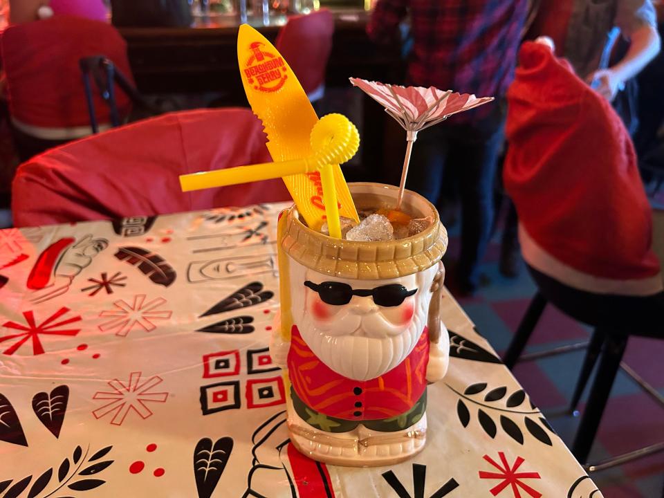 The "Sippin' Santa" at Nickel City comes with a little surfboard.