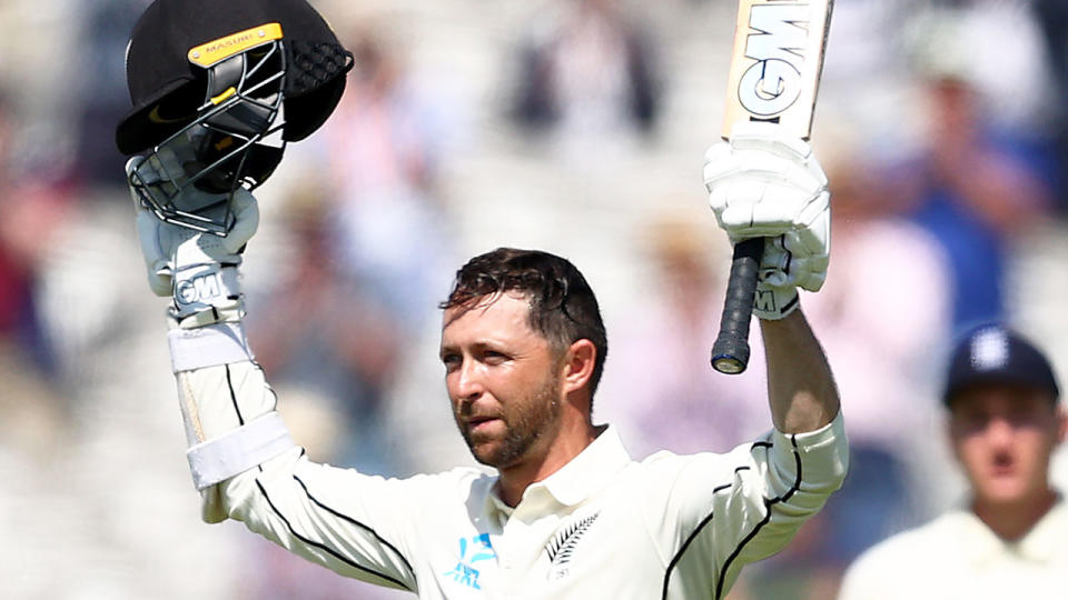 Pictured here, Devon Conway raises his bat after hitting 200 runs against England.