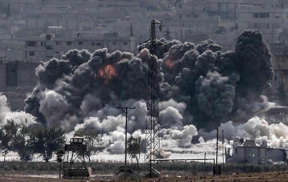 Smoke rises following a US airstrike on Kobani, 28 October 2014 (AFP/Getty)