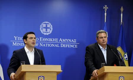 Greek Prime Minister Alexis Tsipras speaks during a news conference as Defence Minister Panos Kammenos (R) looks on in this handout photo released by the Greek Defence Ministry in Athens, Greece July 2, 2015. . REUTERS/Greek Defence Ministry/Handout via Reuters