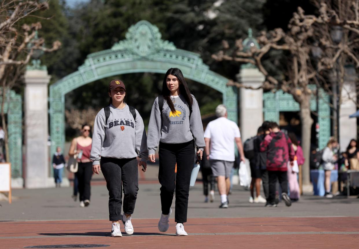 Students wear University of California, Berkeley, school apparel as they walk through Sproul Plaza on the UC Berkeley campus on March 14, 2022, in Berkeley, California.