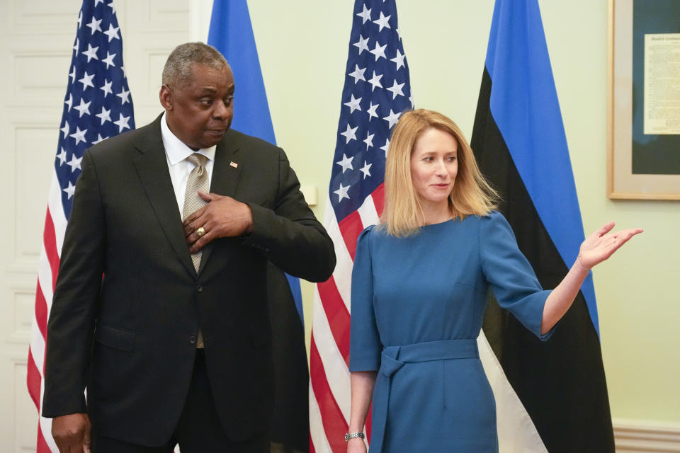 Estonian Prime Minister Kaja Kallas, right, welcomes United States Secretary of Defense Lloyd Austin during their meeting at the Stenbock House in Tallinn, Estonia, Thursday, Feb. 16, 2023. (AP Photo/Sergei Grits)