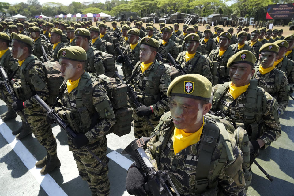 Filipino troopers stand during rites at the 126th founding anniversary of the Philippine Army at Fort Bonifacio in Taguig, Philippines on Wednesday, March 22, 2023. (AP Photo/Aaron Favila)