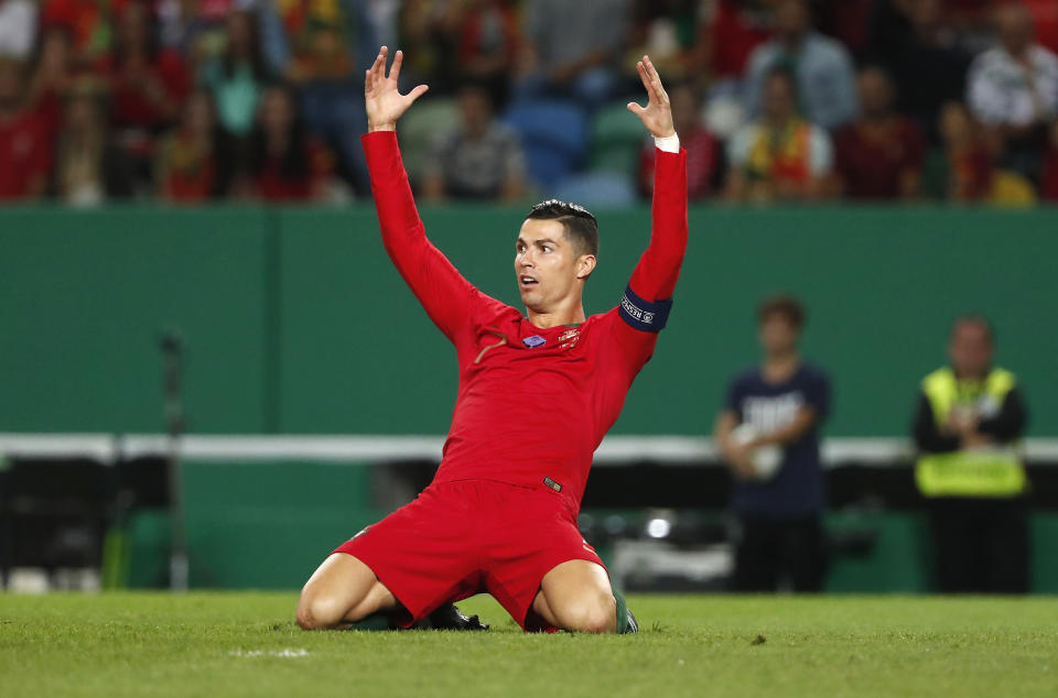 Portugal's Cristiano Ronaldo reacts during the Euro 2020 group B qualifying soccer match between Portugal and Luxembourg at the Jose Alvalade stadium in Lisbon, Friday, Oct 11, 2019. (AP Photo/Armando Franca)