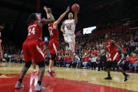 Rutgers guard Jacob Young (42) drives to the basket past Nebraska guard Thorir Thorbjarnarson (34) during the second half of an NCAA college basketball game Saturday, Jan. 25, 2020, in Piscataway, N.J. Rutgers won 75-72. (AP Photo/Adam Hunger)