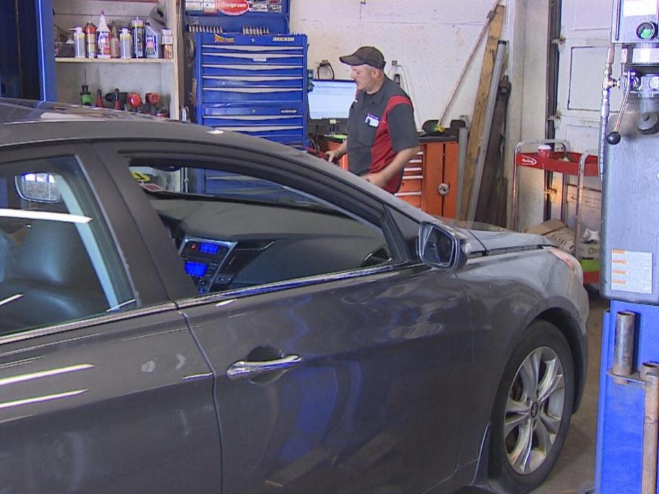 Mechanics at Midtown Auto Repair &amp; Tire in Charlottetown are noticing more customers coming in for repairs on their older vehicles. (Rick Gibbs/CBC - image credit)