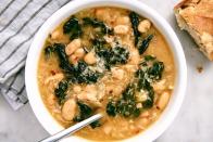 <p>A hearty veggie soup to get you through the day. </p><p>Get the <a href="https://www.delish.com/uk/cooking/recipes/a28784587/vegetarian-kale-soup/" rel="nofollow noopener" target="_blank" data-ylk="slk:Vegetarian Kale Soup;elm:context_link;itc:0;sec:content-canvas" class="link ">Vegetarian Kale Soup</a> recipe. </p>