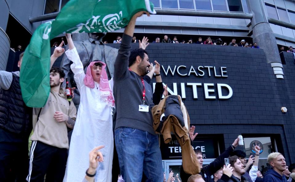 Newcastle fans celebrate at St James’ Park following the announcement that the Saudi-led takeover of the club had been approved in 2021 (PA Archive)