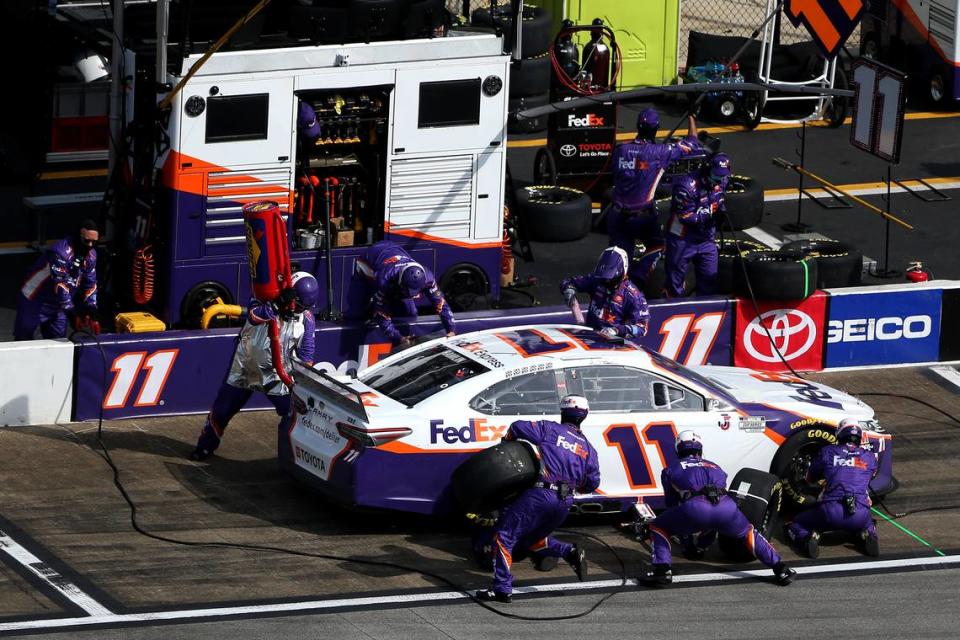 TALLADEGA, ALABAMA - OCTOBER 04: Denny Hamlin, driver of the #11 FedEx Express Toyota, pits during the NASCAR Cup Series YellaWood 500 at Talladega Superspeedway on October 04, 2020 in Talladega, Alabama. (Photo by Brian Lawdermilk/Getty Images)